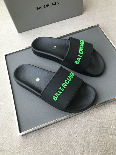 Black and 2025 green balenciaga slides